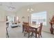 Open concept dining area connects to the living room, offering natural light at 217 Wando River Rd. # 12-H, Myrtle Beach, SC 29579