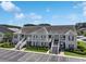 Inviting condo building with dual staircases, manicured landscaping, and ample parking at 217 Wando River Rd. # 12-H, Myrtle Beach, SC 29579