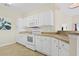Bright kitchen with white cabinets, modern appliances, and convenient layout at 217 Wando River Rd. # 12-H, Myrtle Beach, SC 29579