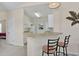 Features a breakfast bar with seating and flows into the adjacent kitchen at 217 Wando River Rd. # 12-H, Myrtle Beach, SC 29579