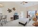 Open living room with neutral carpet, entertainment center, and sliding glass doors at 217 Wando River Rd. # 12-H, Myrtle Beach, SC 29579