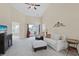 Bright living room with vaulted ceiling, ceiling fan, balcony access, and neutral decor at 217 Wando River Rd. # 12-H, Myrtle Beach, SC 29579