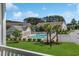 Community pool view showcases pristine landscaping, amenities, and building exteriors in a great location at 217 Wando River Rd. # 12-H, Myrtle Beach, SC 29579