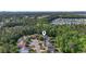 Aerial view showing the property's location within a residential neighborhood near trees and lake at 2170 Buxton Dr., Myrtle Beach, SC 29579