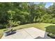 Secluded backyard with a concrete patio and lush landscaping providing privacy at 2170 Buxton Dr., Myrtle Beach, SC 29579