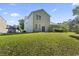 Spacious backyard with green lawn, perfect for outdoor activities, framed by the home's exterior at 2170 Buxton Dr., Myrtle Beach, SC 29579