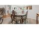Open-concept dining area with view of staircase and living space with unique hardwood flooring design at 2170 Buxton Dr., Myrtle Beach, SC 29579