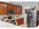 Well-equipped kitchen featuring stainless steel appliances, wood cabinetry and beautiful granite countertops at 2170 Buxton Dr., Myrtle Beach, SC 29579