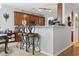 Breakfast bar area with three ornate stools and kitchen cabinets with modern stainless steel microwave at 2170 Buxton Dr., Myrtle Beach, SC 29579