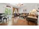 Elegant living room featuring hardwood floors, ceiling fan, and large sliding doors to let in natural light at 2170 Buxton Dr., Myrtle Beach, SC 29579