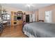 Comfortable bedroom featuring hardwood floors, accent furniture, and an open door to the bathroom at 2170 Buxton Dr., Myrtle Beach, SC 29579