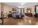 Bright main bedroom featuring hardwood floors, natural light, and large furniture at 2170 Buxton Dr., Myrtle Beach, SC 29579