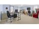 Large office or flex space featuring light blue walls, computer and desk with boxes stacked against the wall at 2170 Buxton Dr., Myrtle Beach, SC 29579