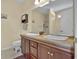 Bathroom featuring double sink vanity, granite countertops, and wood cabinets, offering style and functionality at 2302 Clandon Dr., Myrtle Beach, SC 29579