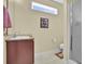 Well-lit bathroom with a vanity, toilet, and a walk-in shower at 2302 Clandon Dr., Myrtle Beach, SC 29579