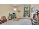 Cozy bedroom with natural light, showcasing a great space for relaxation and hobbies at 2302 Clandon Dr., Myrtle Beach, SC 29579