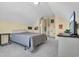Cozy bedroom featuring a comfortable bed, sloped ceilings, and carpet flooring at 2302 Clandon Dr., Myrtle Beach, SC 29579