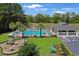 Community pool and playground, perfect for Gathering enjoyment, with ample seating and lush landscaping at 2302 Clandon Dr., Myrtle Beach, SC 29579