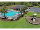 Aerial view of the community pool, playground and parking lot in a landscaped surrounding at 2302 Clandon Dr., Myrtle Beach, SC 29579