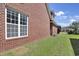Brick exterior of a home featuring a window and green grass at 2302 Clandon Dr., Myrtle Beach, SC 29579