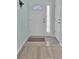 Bright foyer features tile flooring, a white front door with decorative glass, and neutral wall paint at 2302 Clandon Dr., Myrtle Beach, SC 29579