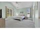 Bright main bedroom featuring vaulted ceilings, large windows, and neutral tones creating a relaxing atmosphere at 2302 Clandon Dr., Myrtle Beach, SC 29579