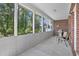 Spacious screened porch with a grill, offering a perfect spot for outdoor dining and relaxation at 2302 Clandon Dr., Myrtle Beach, SC 29579