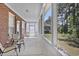 Relaxing screened porch with a ceiling fan, perfect for enjoying the outdoors in comfort at 2302 Clandon Dr., Myrtle Beach, SC 29579