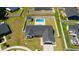 An aerial view of a home highlights the large backyard, private pool, shed, solar panels, and fenced yard at 2506 Berleze Ct., Conway, SC 29527