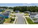 An aerial view shows a neighborhood with well-maintained lawns and a pond, creating a serene environment at 2506 Berleze Ct., Conway, SC 29527