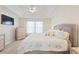 Cozy bedroom with ceiling fan and ensuite bathroom is perfect for relaxing at 2506 Berleze Ct., Conway, SC 29527