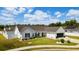 The exterior of this home features a well-maintained yard, solar panels and an attached garage at 2506 Berleze Ct., Conway, SC 29527