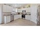 Bright kitchen with white cabinetry, stainless steel appliances, and hardwood floors at 2506 Berleze Ct., Conway, SC 29527