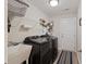 This laundry room has newer washer and dryer units, white shelving, and a sink at 2506 Berleze Ct., Conway, SC 29527
