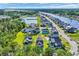 Aerial view of a home in a waterfront community, featuring lush landscaping at 260 Palmetto Harbour Dr., North Myrtle Beach, SC 29582