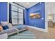 Stylish bedroom featuring blue walls, a cozy bed, and a wall-mounted TV at 260 Palmetto Harbour Dr., North Myrtle Beach, SC 29582