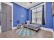 Comfortable bedroom features blue walls, a daybed, and natural light from the window at 260 Palmetto Harbour Dr., North Myrtle Beach, SC 29582