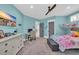 Comfortable bedroom featuring a desk, flat screen tv, and gray paneled doors at 260 Palmetto Harbour Dr., North Myrtle Beach, SC 29582