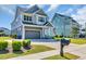 Charming two-story home boasts a manicured lawn and inviting curb appeal at 260 Palmetto Harbour Dr., North Myrtle Beach, SC 29582