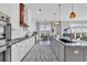 Open kitchen with a central island, modern appliances, and hardwood flooring at 260 Palmetto Harbour Dr., North Myrtle Beach, SC 29582