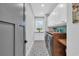 Well-equipped laundry room with washer, dryer, sink, wood countertop, and cabinet storage at 260 Palmetto Harbour Dr., North Myrtle Beach, SC 29582