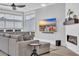 Cozy living room features a gray sofa, a modern fireplace, and a large TV at 260 Palmetto Harbour Dr., North Myrtle Beach, SC 29582