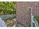 Enclosed backyard featuring a brick wall with outdoor shower and a white picket fence at 2701 Hillside Dr. S # 1, North Myrtle Beach, SC 29582