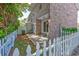 Enclosed backyard featuring a sliding glass door, patio, and a classic white picket fence at 2701 Hillside Dr. S # 1, North Myrtle Beach, SC 29582
