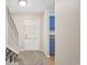 Welcoming entryway featuring neutral tones, carpeted stairs, and adjacent blue cabinetry at 2701 Hillside Dr. S # 1, North Myrtle Beach, SC 29582