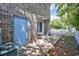Brick building with a blue door and white picket fence providing a charming, private outdoor space at 2701 Hillside Dr. S # 1, North Myrtle Beach, SC 29582