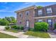 Inviting townhome exterior with brick facade, landscaped front yard, and convenient access steps at 2701 Hillside Dr. S # 1, North Myrtle Beach, SC 29582