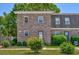 Charming brick townhome featuring well-maintained landscaping and a cozy entrance at 2701 Hillside Dr. S # 1, North Myrtle Beach, SC 29582