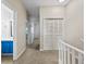 Hallway leads to the bathroom and bedroom with natural light and modern carpet at 2701 Hillside Dr. S # 1, North Myrtle Beach, SC 29582