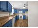 Cozy kitchen with blue cabinetry, wood countertops, and stainless steel appliances at 2701 Hillside Dr. S # 1, North Myrtle Beach, SC 29582